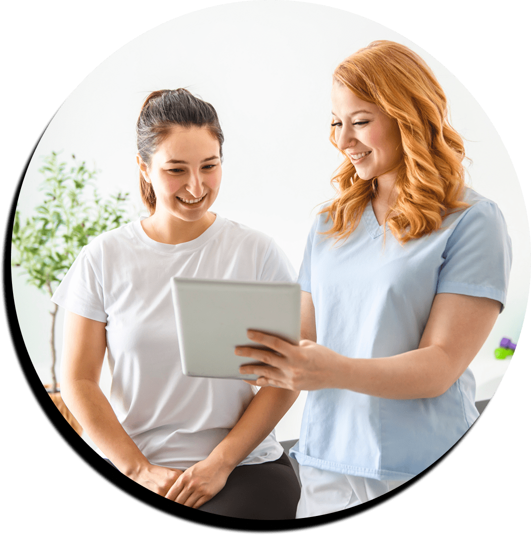 Healthcare professional showing tablet to patient